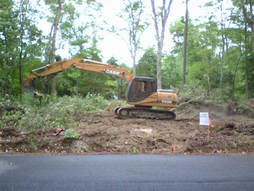 Lot clearing using heavy equipment in Chesapeake, Virginia
